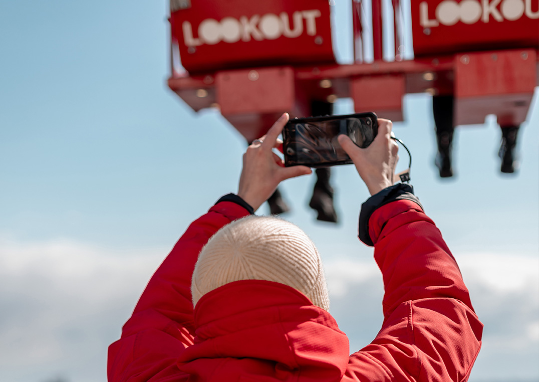 Guests looking through their photos on an order station