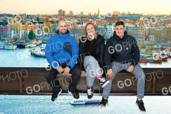 Three friends composited onto the ledge in the evening light, Amsterdam's canal houses lit up behind them